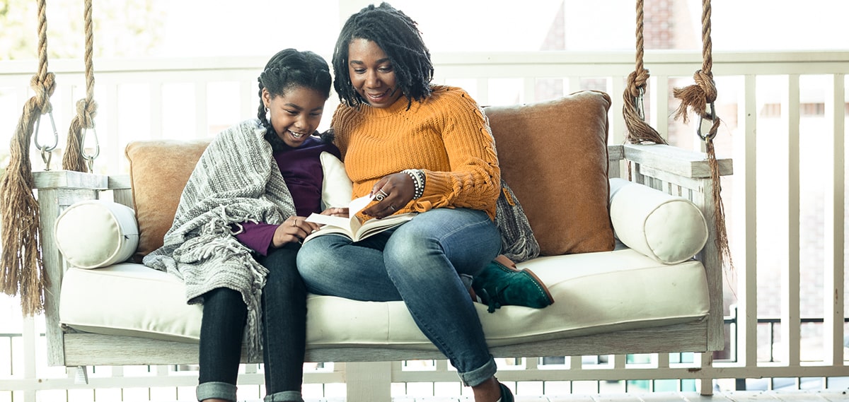 Mother and daughter sitting together